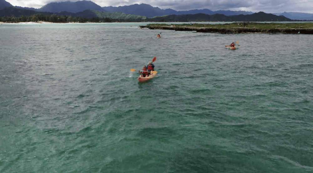 People paddling to Popoia Island with their tandem kayak rentals from Active Oahu